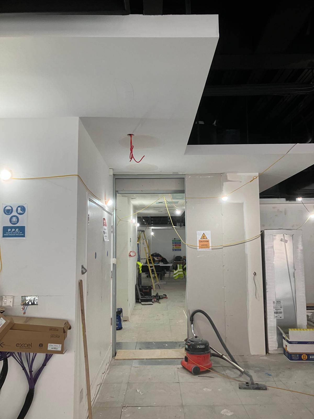 Corridor with plasterboard bulkhead and ceiling